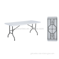 White plastic outdoor folding dining table and chair
